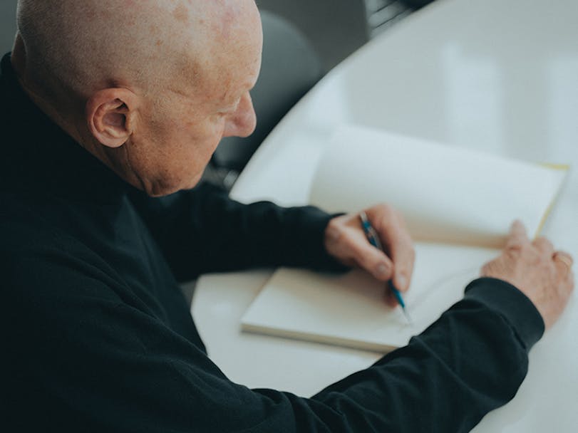 Lord Norman Foster sketching on notepad